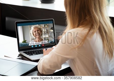 Happy Middle Aged Woman Making Video Call With Young Daughter.