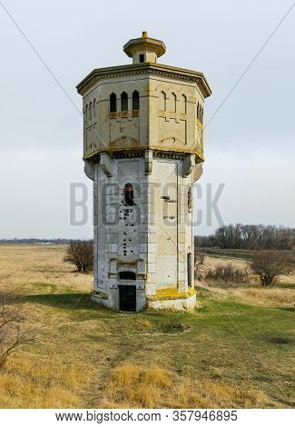 Old Abandoned Beton Water Tower In Steppe Near Stavropol, Russia, Built In 1910s