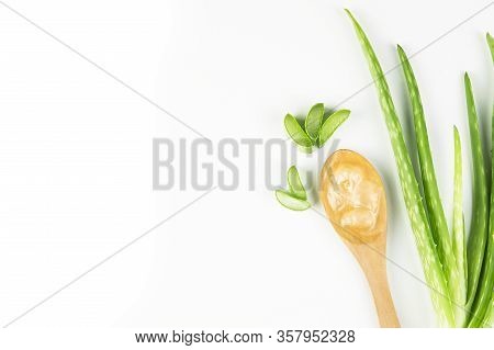 Aloe Vera Gel Close-up. Sliced Aloe Vera Plants Leaf And Gel With Wooden Spoon , Natural Organic Cos