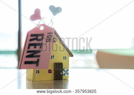 House For Rent Or Property Concept : Wood Model Home And Tag Paper Letter 