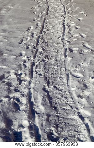 Traces Of Transport Passing Through Snowdrifts In The Winter, The Park In The Winter After A Snow St