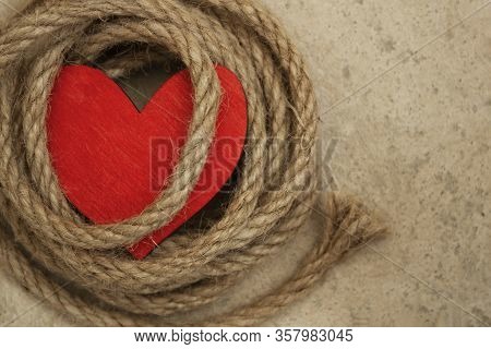 Heart And Rope On A Concrete Floor. Sexual Abuse Concept , Fatal Love, Dominant Conceptual