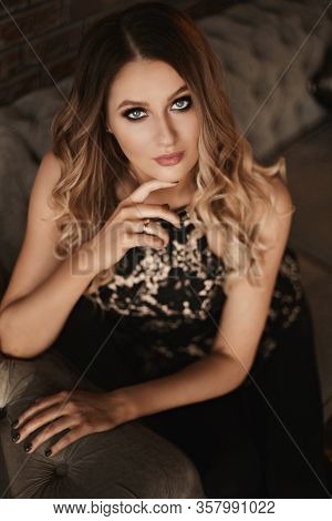 Young Woman With Blond Hair And Perfect Trendy Makeup. Beautiful Blonde Model Girl With Modish Makeu