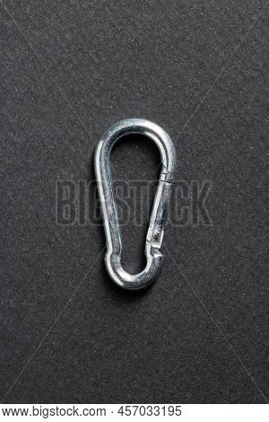 4mm Climbing Carabiner Isolated Against A Dark Background