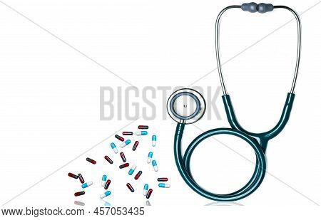 Green Stethoscope And Pile Of Capsule Pills Isolated On White Background With Copy Space For Text. M