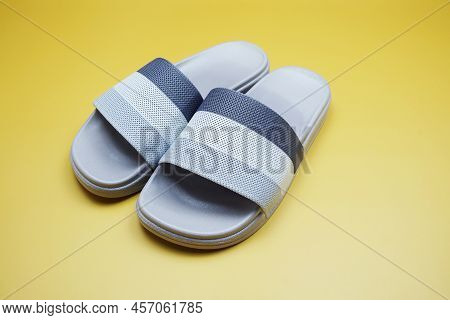 Gray Slide Sandal Summer Slippers On Yellow Background