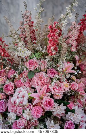 Big Bouquet Of Flowers In A Vase On A Gray Wall Background
