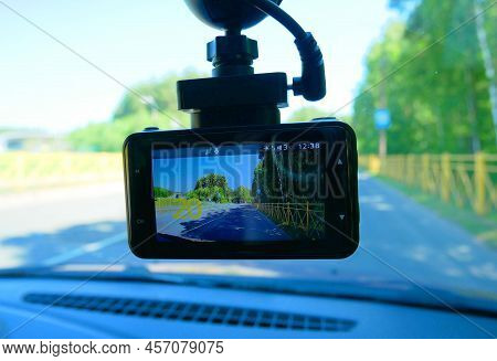 Installing The Dvr In The Car. Dvr On The Windshield Of The Car.