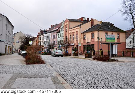 Guben, Germany - January 5, 2013: View At Town Street With Cobblestone Road And Buildings Exterior A