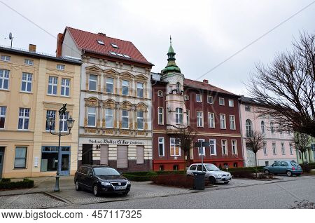 Guben, Germany - January 5, 2013: Cars Parked At Residential Buildings Along Street In Town.