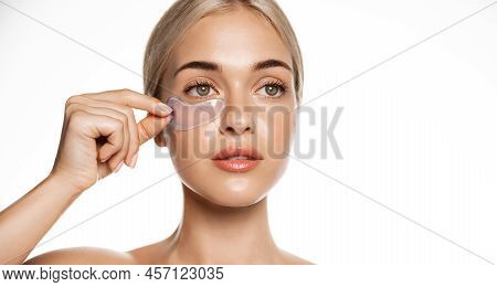 Close Up, Woman With Perfect Glowing Facial Skin, Puts On Under Eye Cosmetic Patches From Dark Circl