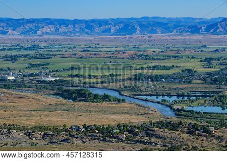 Landscape View Of The Book Cliffs And The Colorado River Running Through Fruita, Colorado.