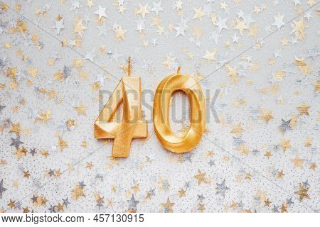 Number 40 Fourty Golden Celebration Birthday Candle On Festive Background. Fourty Years Birthday. Co