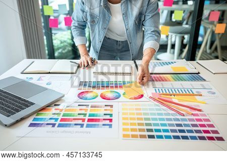 Young Creative Graphic Designer Working On Color Selection And Drawing On Graphics Tablet At Workpla