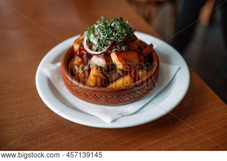 Georgian National Dish Ojahuri With Meat On Wooden Background.