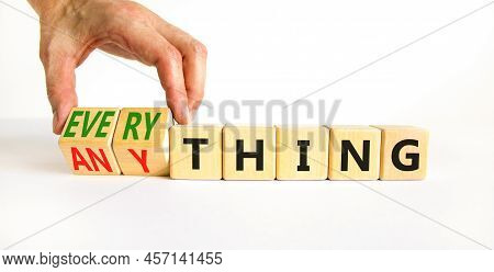 Anything Or Everything Symbol. Businessman Turns Cubes And Changes The Concept Word Anything To Ever