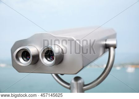 Metal Tower Viewer Installed Near Sea. Mounted Binoculars