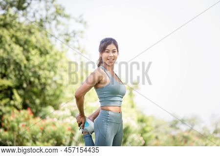 Sportswoman Warming Up Outdoors, Fitness Woman In Sport Clothes Warm Up Training Do Stretch Exercise