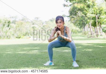Sportswoman Warming Up Outdoors, Fitness Woman In Sport Clothes Warm Up Training Do Stretch Exercise