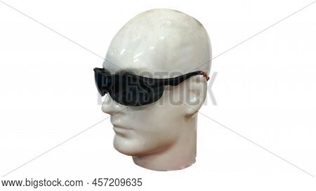 Black Glasses Are Being Displayed On The Manakin's Head, These Glasses Are To Protect The Eyes From 