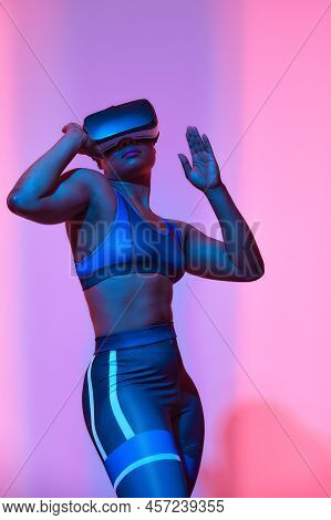 Modern African Black Woman With Short Hiar In Sport Top And Leggings Wearing Glasses Of Virtual Real