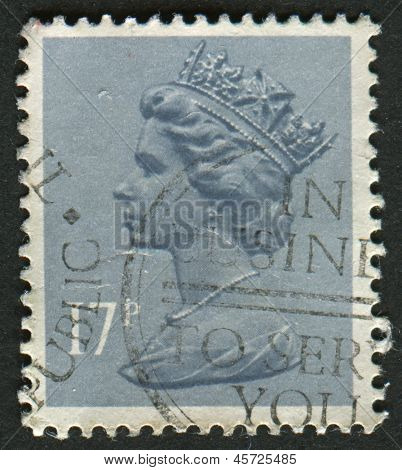 UK-CIRCA 1983:A stempel trykt i UK viser billede af Elizabeth II er den forfatningsmæssige monark af 16 