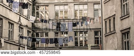 Washed Clothes Drying Outside Of An Old House. Washed Clothes Drying. Fresh Clean Clothes Are Drying