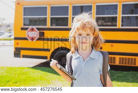 Back To School. Happy Child Near School Bus. Cute School Boy Potrait.