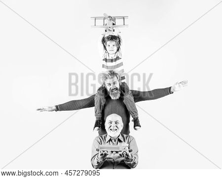 Grandfather Father And Grandson Are Hugging Looking At Camera And Smiling. Fathers Day Concept. Men 