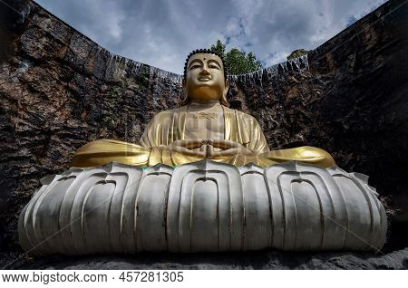 Big Golden Buddha Statue In The Middle Of A Beautiful Cavein, Luang Pho Toh Mahayana At Wat Laksee R