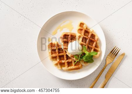 Trendy Delicious Breakfast With Croffles On A White Background. Croissant As Waffle.