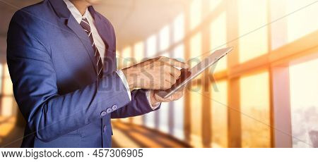 Businessman With Tablet Computer Work In Office