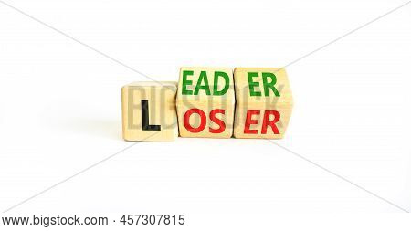 Loser Or Leader Symbol. Concept Words Loser Or Leader On Wooden Cubes. Beautiful White Table White B