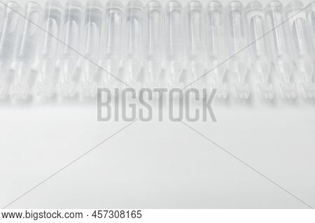 Single Dose Ampoules Of Sterile Isotonic Sea Water Solution On White Background. Space For Text
