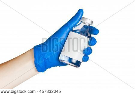 A Bottle Of Saline In The Doctors Hand. Medical Procedures.