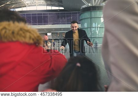 Happy Young Middle Eastern Man, Father Runs To Meet His Family After Business Trip At The Internatio
