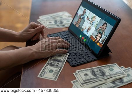 Tablet Screen And Lot Of Hundred Dollar Bills. Business And Social Networking Concept