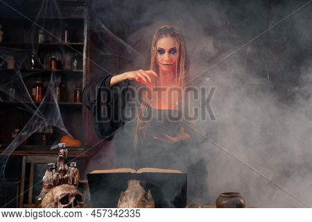Halloween, Witch Use Magic Book And Cauldron Prepare Poison Or Love Potion. Black Magic Wizard In Da