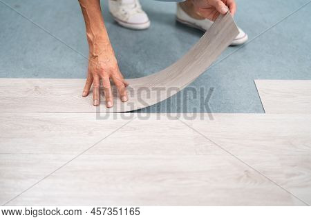 Installing New Vinyl Laminate. Woman Fixing Floor. Diy Project
