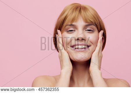 Photo With An Empty Space Of A Pleasant, Lovely Woman With Perfect Skin, Standing On A Pink Backgrou