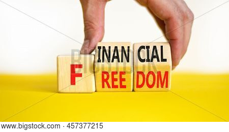 Financial Freedom Symbol. Concept Words Financial Freedom On Wooden Cubes. Businessman Hand. Beautif