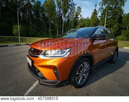 Minsk, Belarus - June 2022: Orange Geely Coolray Car.