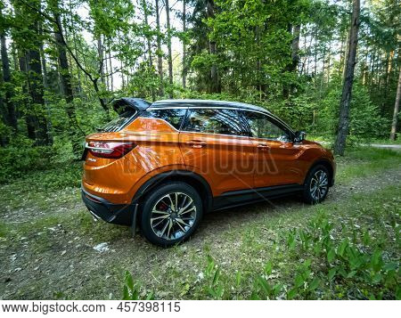 Minsk, Belarus - June 2022: Orange Geely Coolray Car.