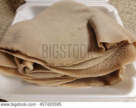 Foam Container With Stack Or Pile Of Ethiopian Bread Called Injera