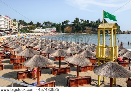 Ulcinj, Montenegro - June 4, 2022: Umbrellas And Deck Chairs On The Beach In Ulcinj. Ulcinj Is The S