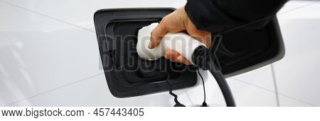 Close-up Of Hand Holding Fuel Nozzle To Add Gas At Petrol Station, Refueling Car With Diesel. Clean 