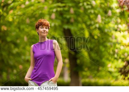 Woman Of Non Binary Gender Identity In Summer Park