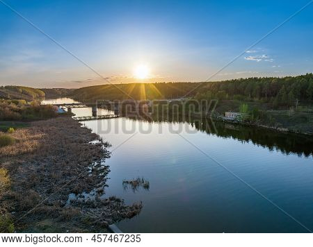 Beautiful View Of The Bridge Across The Iset River In The City Of Kamensk-uralsky At Sunset In Sprin