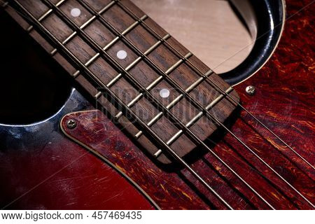 Metallic Volume Treble Guitar Bass Knobs. Electric Guitar. Red Electric Bass Guitar Close-up. Musica