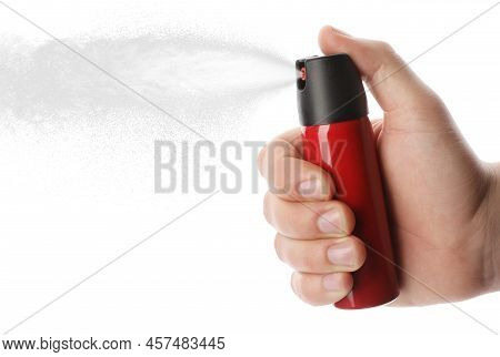 Man Using Pepper Spray On White Background, Closeup
